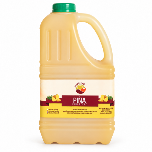 Los Andes Foods pineapple pulp in a yellow 64 fl oz jug with a green cap and pineapple illustrations on the label.